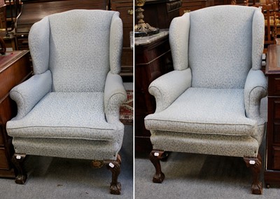 Lot 1293 - A Pair of 20th Century Wing Back Chairs in...