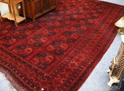 Lot 1018 - An Ersari Carpet, the madder field with four...