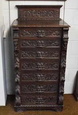 Lot 1191 - A Victorian Carved Oak Wellington Chest, in...