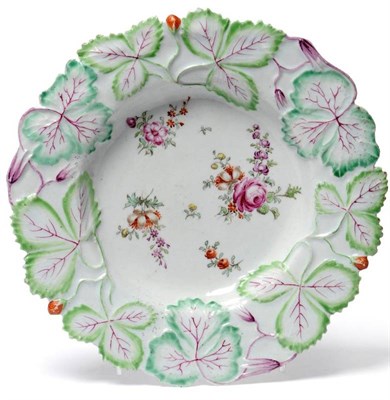 Lot 50 - A Longton Hall Porcelain Strawberry Leaf Moulded Plate, circa 1755, painted in colours with...