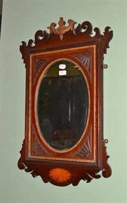 Lot 521 - An Edwardian mahogany wall mirror in the Georgian style and two small wall mirrors