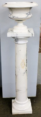 Lot 1198 - A White and Grey Veined Marble Urn, on column...