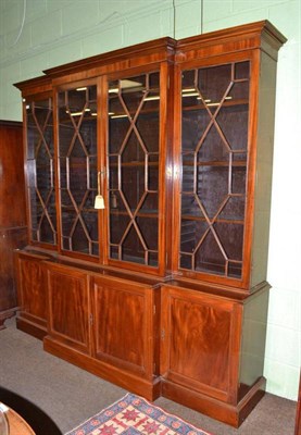 Lot 523 - A George III style mahogany breakfront bookcase