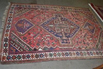 Lot 530 - Kashgai rug, the raspberry field centred by a large medallion framed by spandrels and ivory...