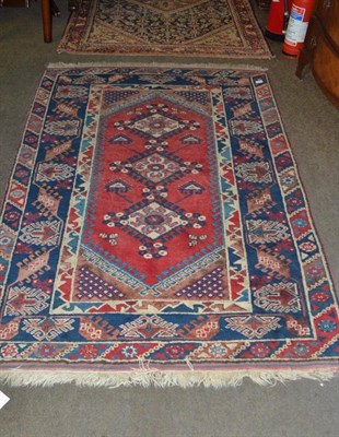 Lot 531 - Dosamalti rug, West Anatolia, the blood red lozenge field with three diamond medallions framed...