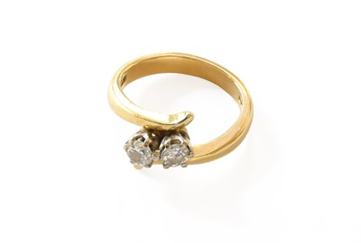 Lot 152 - An 18 Carat Gold Diamond Two Stone Twist Ring,...