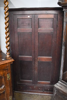 Lot 1132 - A George III Large Oak Hanging Corner Cupboard,...