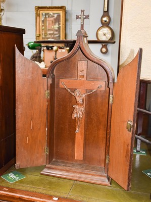 Lot 1146 - A Carved Wood Crucifix, within an oak two door...