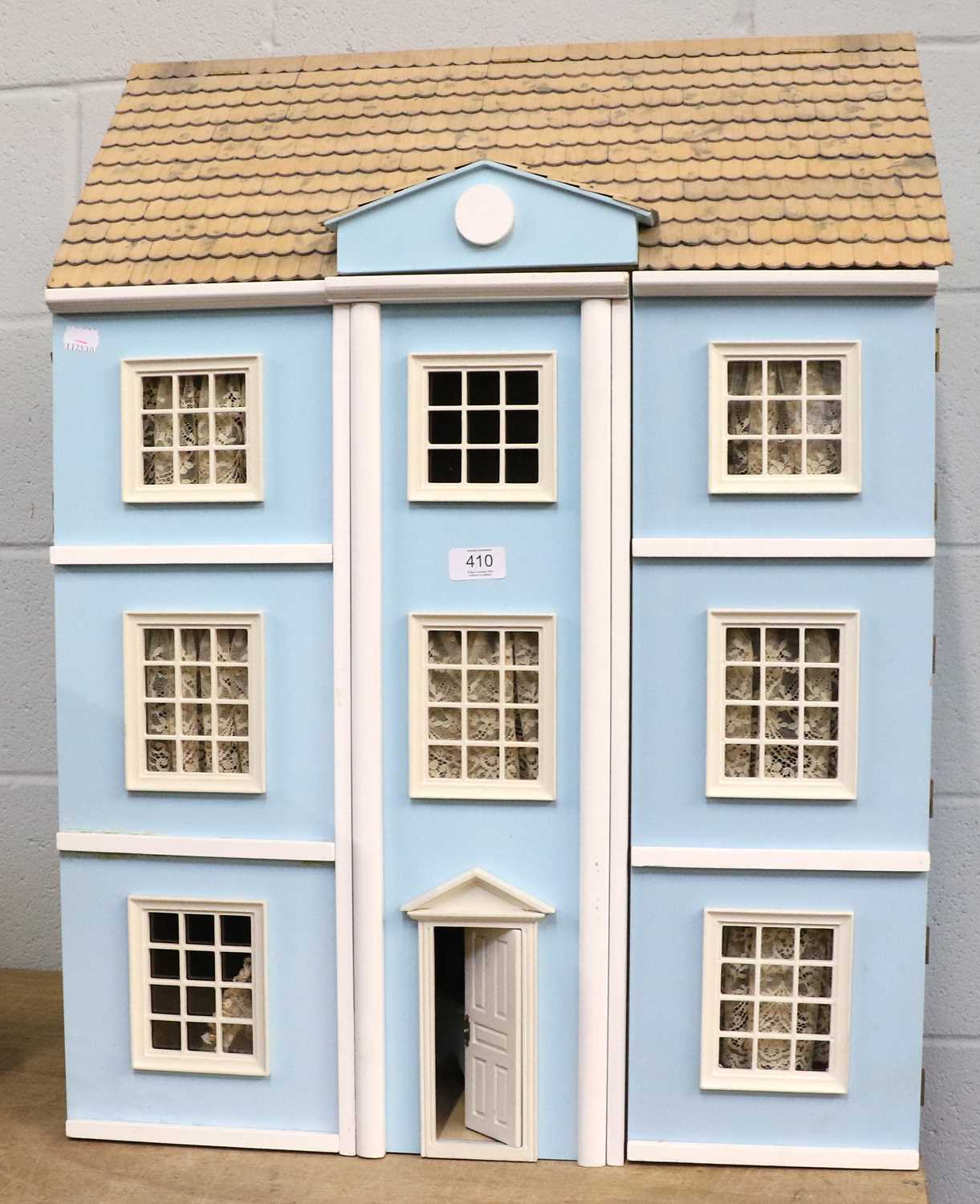 Lot 410 - A Blue Painted Dolls House, three storey with...