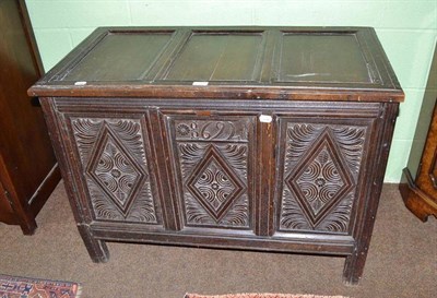 Lot 540 - An 18th century carved oak coffer, dated 1692