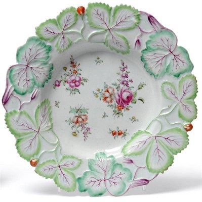 Lot 53 - A Longton Hall Porcelain Strawberry Leaf Moulded Plate, circa 1755, painted in colours with...