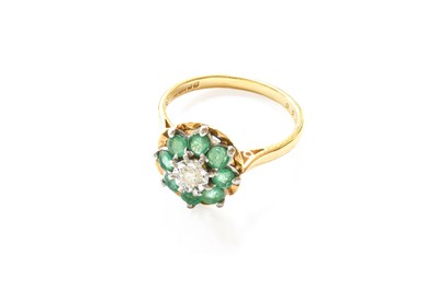 Lot 153 - An 18 Carat Gold Emerald and Diamond Cluster...