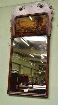 Lot 550 - A Georgian style walnut pier glass painted with a hunting scene