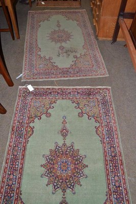 Lot 560 - Pair of Kashmir rugs, North West India, each with a mid green field centred by a pole medallion...