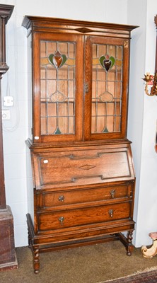 Lot 1120 - An Early 20th Century Arts & Crafts Style Oak...