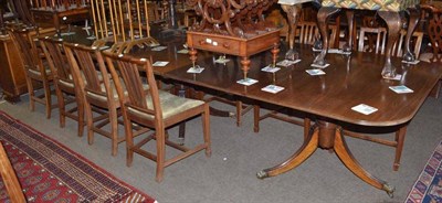 Lot 573 - Dining suite comprising twelve dining chairs and a triple pillar dining table