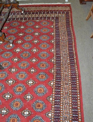 Lot 585 - Salor design carpet, probably Lahore, the rust field with five columns of guls enclosed by multiple