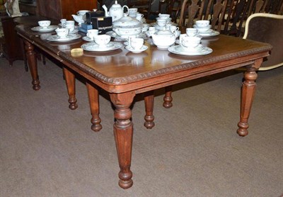 Lot 586 - A 19th century dining table on turned legs