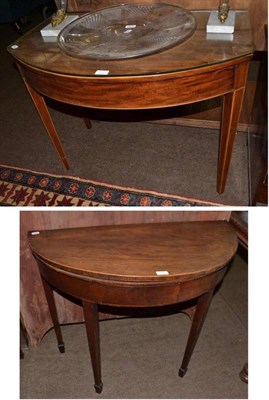 Lot 587 - A Georgian mahogany demi lune fold over card table and bow front side table