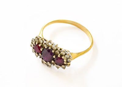 Lot 183 - An 18 Carat Gold Synthetic Ruby and Diamond...