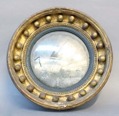 Lot 58 - A Regency Gilt Framed Convex Mirror, with gilt...