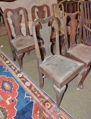 Lot 593 - A set of six 18th century oak panel seated chairs with solid shaped splats, with four 20th...