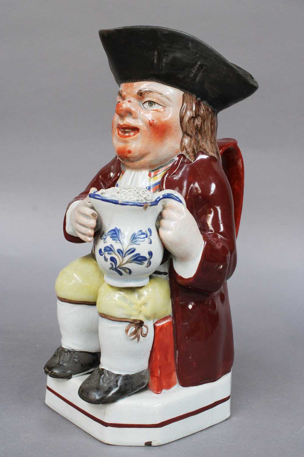 Lot 46 - An Early 19th Century Pearlware Toby Jug, by...