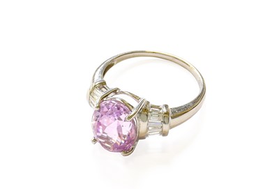 Lot 172 - A Kunzite and Diamond Ring, the oval cut...