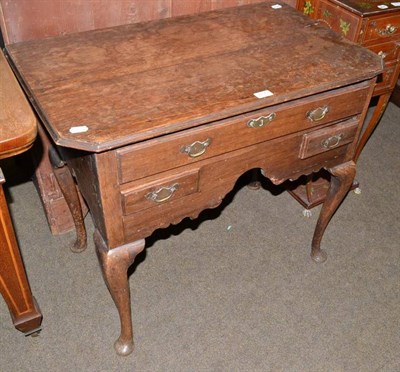 Lot 617 - An 18th century oak lowboy