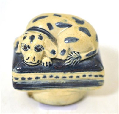 Lot 61 - A Pearlware Patchbox and Cover, early 19th century, modelled as a spaniel lying on a cushion picked