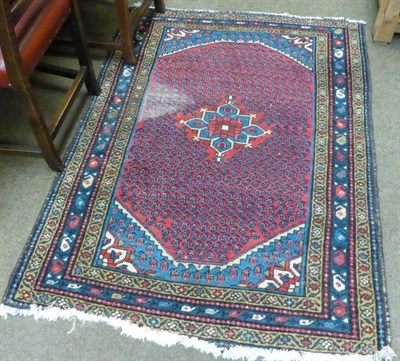 Lot 625 - Mir rug, West Persia, the raspberry field of boteh centred by a florwerhead medallion framed by...