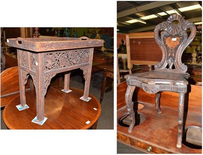 Lot 629 - German/Swiss musical chair and a Burmese carved hardwood tray top table