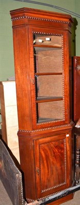 Lot 630 - A glazed mahogany corner cupboard