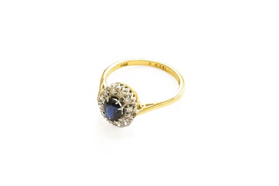 Lot 5 - An 18 Carat Gold Sapphire and Diamond Cluster...