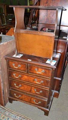 Lot 637 - A reproduction mahogany four height chest and magazine rack