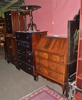 Lot 638 - Two Stag chest of drawers, a mahogany bureau, a mahogany television cabinet, an open bookcase...