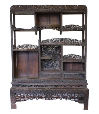 Lot 207 - A Chinese Carved Hardwood Display Cabinet,...