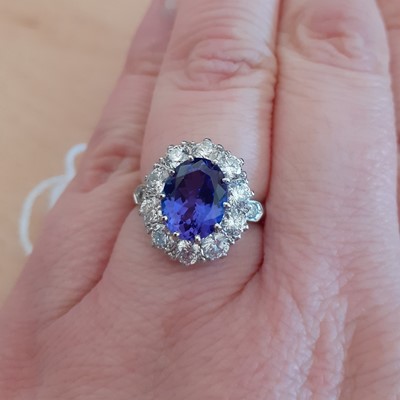 Lot 2018 - A Tanzanite and Diamond Cluster Ring the oval...