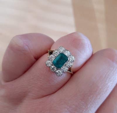 Lot 2058 - An Emerald and Diamond Cluster Ring the...