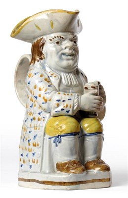 Lot 63 - A Pratt Type Pottery Toby Jug, circa 1800, of traditional form, wearing a yellow lined hat,...