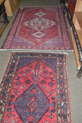 Lot 642 - Hamadan rug, Persian Kurdistan, the candy pink field centred by an indigo lozenge medallion...