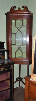 Lot 645 - A glazed mahogany floor standing corner cupboard