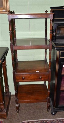 Lot 647 - A George IV rosewood four tier whatnot