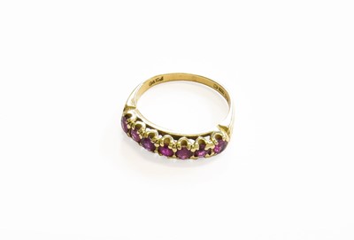 Lot 52 - A 9 Carat Gold Ruby Seven Stone Ring, finger...