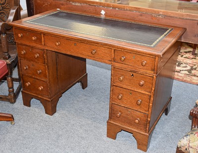 Lot 1349 - A Victorian Oak Leather Inset Pedestal Desk,...