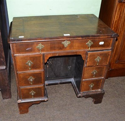 Lot 655 - An 18th century walnut small knee-hole desk (converted)