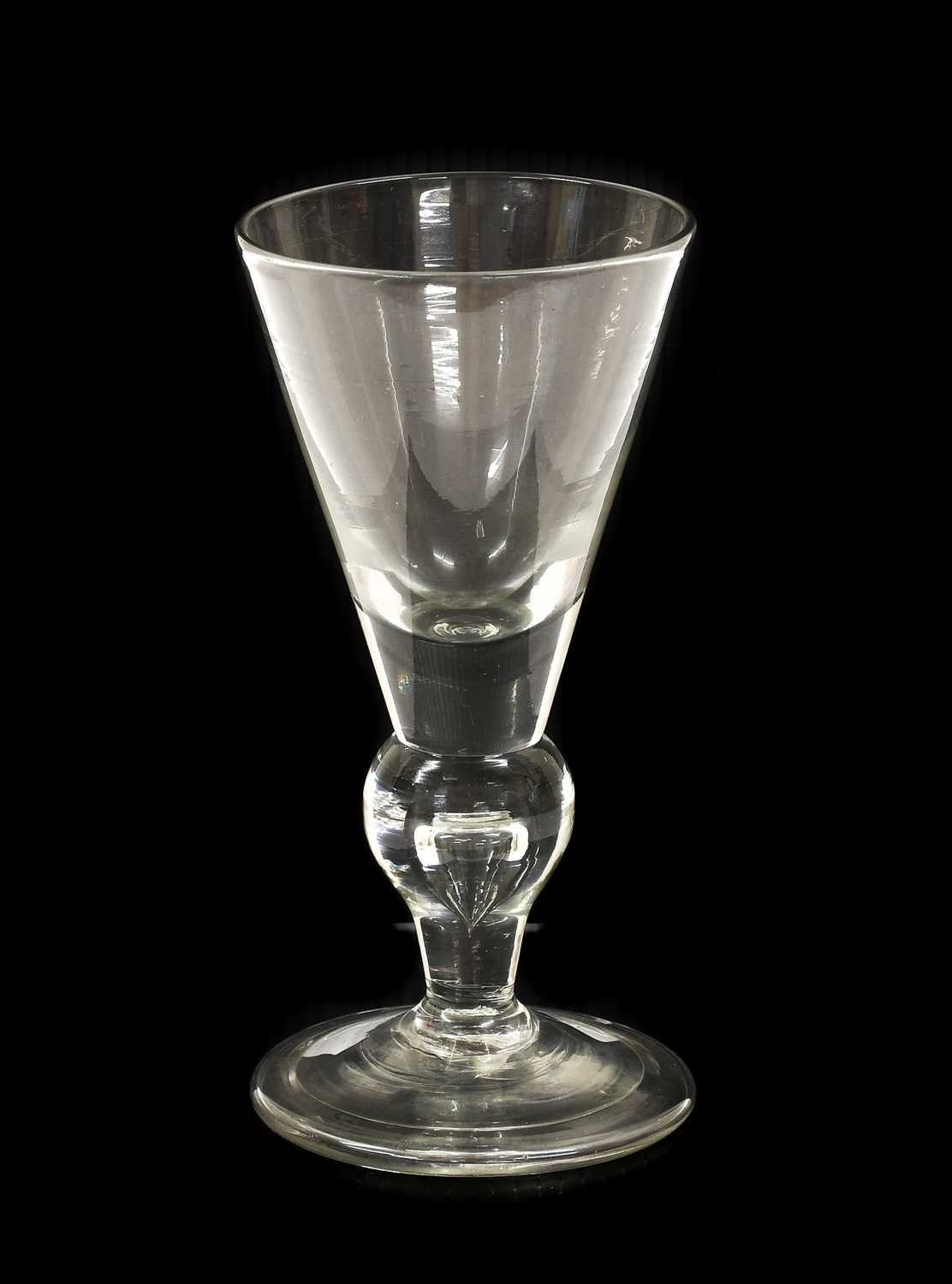 Lot 1 - A Heavy Baluster Wine Glass, circa 1710, the...