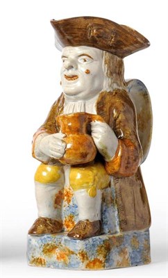 Lot 65 - A Pratt Type Pottery Toby Jug, circa 1800, of traditional form, with brown hat and coat and...