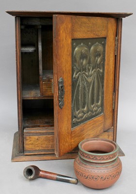 Lot 379 - An Arts and Crafts Oak Smoker's Cabinet, the...