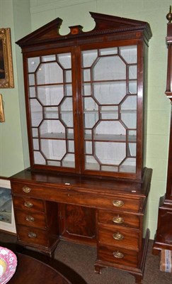 Lot 667 - A George III mahogany secretaire bookcase with knee-hole base